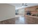 Cozy living room showcases a brick fireplace and a partial view of the kitchen at 514 E Barrus Pl, Casa Grande, AZ 85122