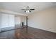 Bright living room with hardwood floors, multiple closets, and neutral paint at 514 E Barrus Pl, Casa Grande, AZ 85122