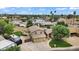 Aerial view of home with a pool, well manicured lawn, lush landscaping, and a basketball court at 609 W Mcnair St, Chandler, AZ 85225
