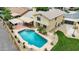 Stunning backyard featuring a sparkling pool, covered patio, and landscaped yard ideal for relaxing and entertaining at 609 W Mcnair St, Chandler, AZ 85225