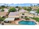Aerial view of home with a pool, lush landscaping, patio, and hot tub at 609 W Mcnair St, Chandler, AZ 85225