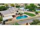 Aerial view of home with pool, covered patio, grassy backyard, and RV parking in a residential neighborhood at 609 W Mcnair St, Chandler, AZ 85225