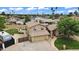 Aerial view of front of home, lawn, lush landscaping, RV gate, and pool in backyard at 609 W Mcnair St, Chandler, AZ 85225