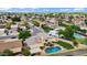 Desirable neighborhood home with a private backyard oasis, including a pool, grassy area, and mature trees at 609 W Mcnair St, Chandler, AZ 85225