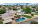 Aerial view of home with a pool, lush landscaping, patio, and covered patio at 609 W Mcnair St, Chandler, AZ 85225