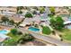 Beautiful backyard with a sparkling pool, manicured lawn, and privacy fence in a quiet residential area at 609 W Mcnair St, Chandler, AZ 85225