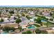Aerial view of home with a pool, well manicured lawn, and lush landscaping at 609 W Mcnair St, Chandler, AZ 85225