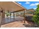 Inviting covered patio with stamped concrete, leading to a sparkling swimming pool and spa at 609 W Mcnair St, Chandler, AZ 85225