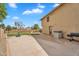 Large backyard featuring a sports court with a basketball hoop and a well-maintained lawn at 609 W Mcnair St, Chandler, AZ 85225