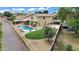Wide aerial view of backyard, pool, patio, landscaping, and a basketball court at 609 W Mcnair St, Chandler, AZ 85225