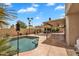 Inviting backyard with a pool, covered patio, and mature landscaping at 609 W Mcnair St, Chandler, AZ 85225