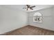 Neutral bedroom featuring a ceiling fan and window with natural light at 609 W Mcnair St, Chandler, AZ 85225