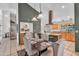 Dining area with stylish chairs, modern lighting fixtures, and an open layout with adjacent kitchen at 609 W Mcnair St, Chandler, AZ 85225