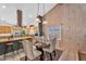 Dining area showcasing stylish chairs, elegant lighting, and a view of the kitchen at 609 W Mcnair St, Chandler, AZ 85225