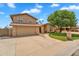 Charming two-story home with stone accents, lush lawn and manicured landscaping at 609 W Mcnair St, Chandler, AZ 85225