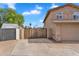 Attractive two-story home with a stone facade, three-car garage and gated parking at 609 W Mcnair St, Chandler, AZ 85225