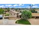 Inviting two-story home with a manicured lawn, mature tree, and charming curb appeal in a Gathering-friendly neighborhood at 609 W Mcnair St, Chandler, AZ 85225
