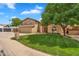 Charming two-story home with a well-manicured lawn and stone accents on the facade at 609 W Mcnair St, Chandler, AZ 85225
