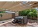 Inviting backyard hot tub under a pergola, perfect for relaxing and entertaining at 609 W Mcnair St, Chandler, AZ 85225