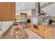 Modern kitchen featuring granite countertops, stainless steel appliances, and custom wood cabinets at 609 W Mcnair St, Chandler, AZ 85225