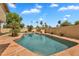 Private in-ground pool surrounded by lush landscaping creating a private backyard oasis at 609 W Mcnair St, Chandler, AZ 85225