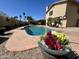 Relaxing pool with beautiful landscaping and patio area, perfect for outdoor entertaining and enjoying the backyard at 609 W Mcnair St, Chandler, AZ 85225
