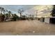 Large backyard featuring desert landscaping and several storage sheds at 8125 E 5Th Ave, Mesa, AZ 85208