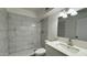 Modern bathroom featuring white marble-look tile walls and flooring, and updated fixtures and vanity at 8125 E 5Th Ave, Mesa, AZ 85208