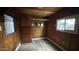 This bedroom features wood paneling, built-in storage, closet and window providing natural light at 8125 E 5Th Ave, Mesa, AZ 85208