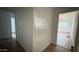 Bright hallway with wood-look flooring leading to other rooms in the home at 8125 E 5Th Ave, Mesa, AZ 85208