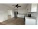 Bright kitchen featuring white cabinets, stainless steel appliances, and light wood floors at 8125 E 5Th Ave, Mesa, AZ 85208
