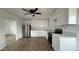 Bright kitchen featuring white cabinets, stainless steel appliances, and light wood floors at 8125 E 5Th Ave, Mesa, AZ 85208