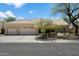 Charming single-story home with a three-car garage, tiled roof, and mature landscaping in a well-maintained community at 9059 E Butherus Dr, Scottsdale, AZ 85260