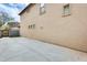 Backyard featuring a concrete patio and block wall, creating a low-maintenance outdoor space at 9435 S 33Rd Dr, Laveen, AZ 85339