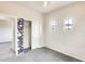 Cozy bedroom with three windows, closet with art, and carpeted floor at 9435 S 33Rd Dr, Laveen, AZ 85339