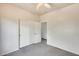 Bedroom with carpeted floors, walk-in closet and view to the entry way at 9435 S 33Rd Dr, Laveen, AZ 85339