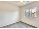 Bright bedroom featuring neutral walls, carpet, a window, and ceiling fan at 9435 S 33Rd Dr, Laveen, AZ 85339