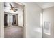 Bedroom with ceiling fan, gray carpet and drapes, plus two small windows at 9435 S 33Rd Dr, Laveen, AZ 85339