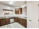 Kitchen showcasing wood cabinets, stainless steel appliances, and light countertops with lots of natural light from the window at 9435 S 33Rd Dr, Laveen, AZ 85339