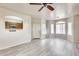 Spacious living area with a view to kitchen and a large entry door at 9435 S 33Rd Dr, Laveen, AZ 85339
