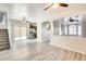 Open-concept living area featuring modern flooring, neutral walls, and arched doorways at 9435 S 33Rd Dr, Laveen, AZ 85339