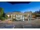 Beautiful backyard with pool, patio dining, desert landscaping, lounge seating, and upscale home exterior at 9726 E Hidden Green Dr, Scottsdale, AZ 85262