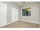 Well lit bedroom offers natural lighting and plank floors at 9726 E Hidden Green Dr, Scottsdale, AZ 85262
