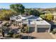 Stunning home exterior with desert landscaping, a circular driveway, and a two-car garage at 9726 E Hidden Green Dr, Scottsdale, AZ 85262
