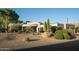 Charming home featuring desert landscaping with cacti, gravel, and plants for a unique curb appeal at 9726 E Hidden Green Dr, Scottsdale, AZ 85262