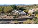 Beautiful home with desert landscaping, a circular driveway, and mountain views in the background at 9726 E Hidden Green Dr, Scottsdale, AZ 85262