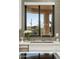Kitchen sink area offering views of the desert landscape and a decorative backsplash at 9726 E Hidden Green Dr, Scottsdale, AZ 85262
