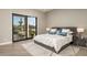 Spacious main bedroom featuring a modern design and a large window with desert views at 9726 E Hidden Green Dr, Scottsdale, AZ 85262