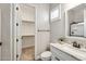 Elegant bathroom featuring a walk-in closet, shower, and stylish vanity with stone countertop at 9903 E Rotation Dr, Mesa, AZ 85212