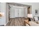 Bright entryway showcasing double doors, recessed lighting, and wood-look floors at 9903 E Rotation Dr, Mesa, AZ 85212